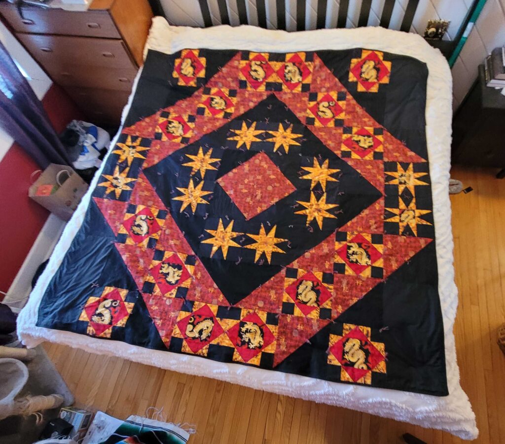 Red, black and gold quilt with Chinese dragons
